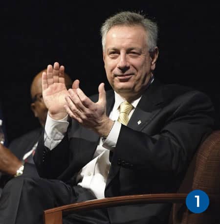 UD President Dennis Assanis applauds the NIIMBL team at the ceremony announcing its headquarters at the UD.